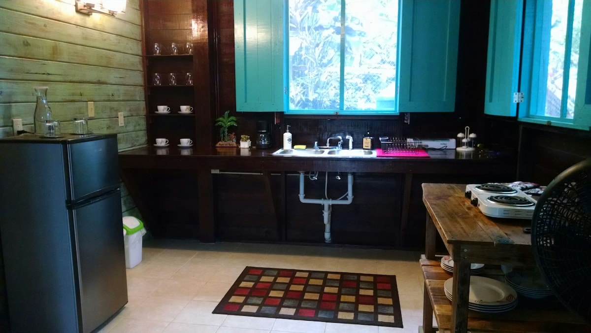 Kitchen and dining area inside the Garden Apartment at SurfBreak at Paunch