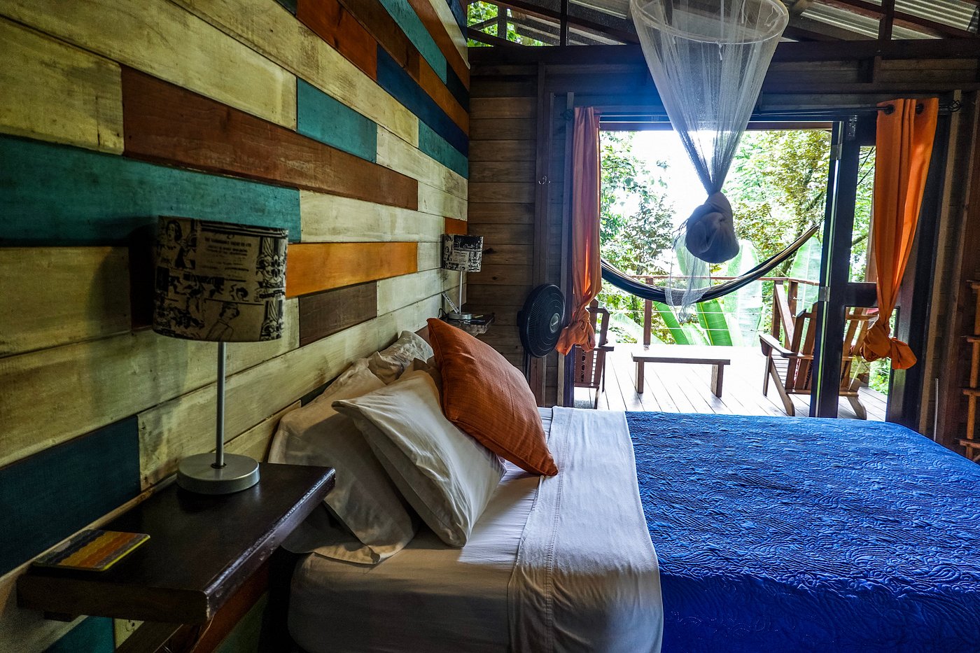 Bungalow Right bedroom opening onto a private jungle porch with a hammock at SurfBreak at Paunch